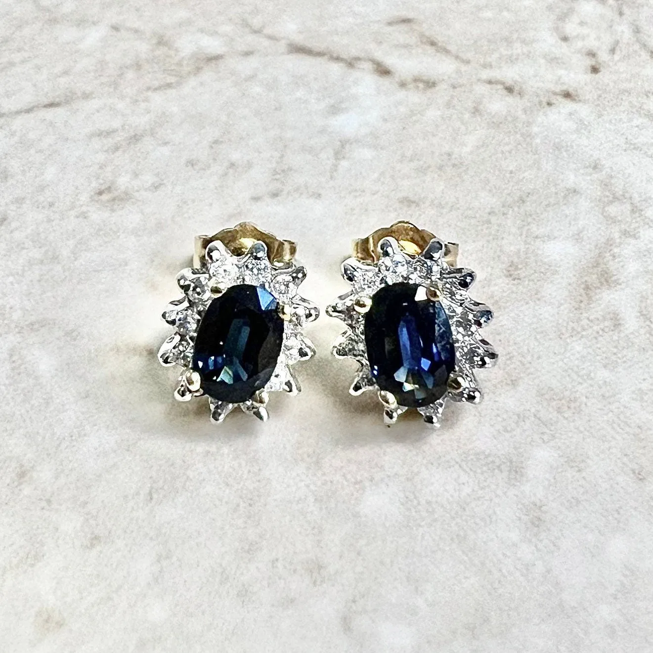 14 Karat Two-Tone Oval Blue Sapphire & Diamond Halo Stud Earrings