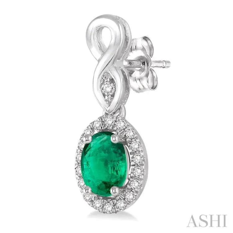 5x3 MM Oval Cut Emerald and 1/6 ctw Round Cut Diamond Earrings in 10K White Gold