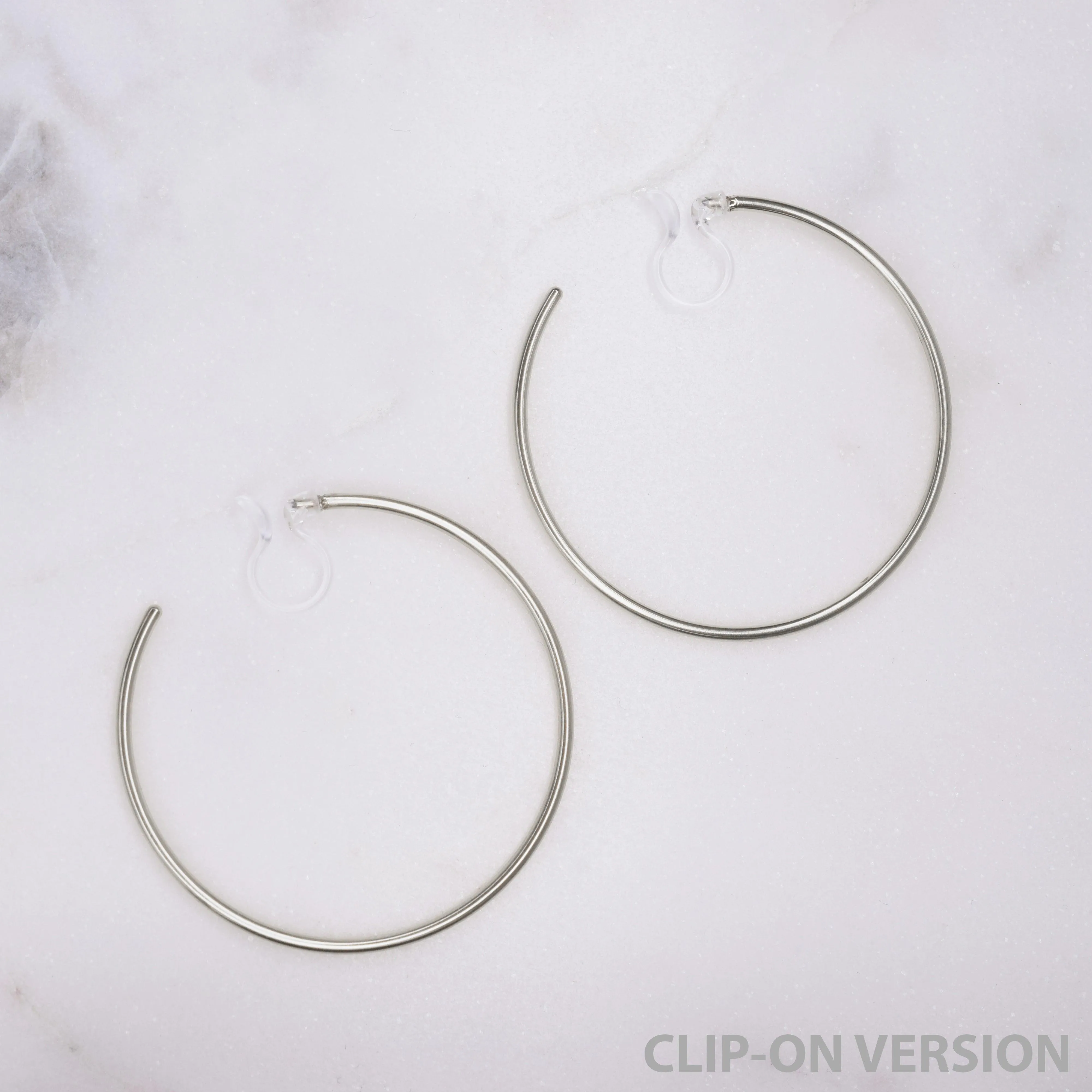 LARGE HOOP CLIP-ON EARRINGS IN SILVER