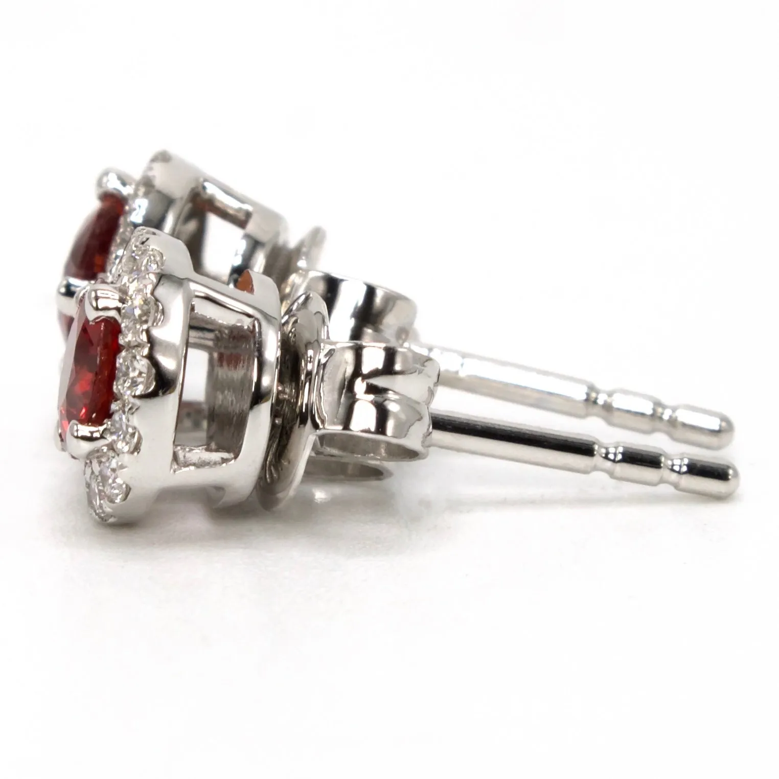 Natural 0.65 Carat Ruby and Diamond Halo Stud Earrings