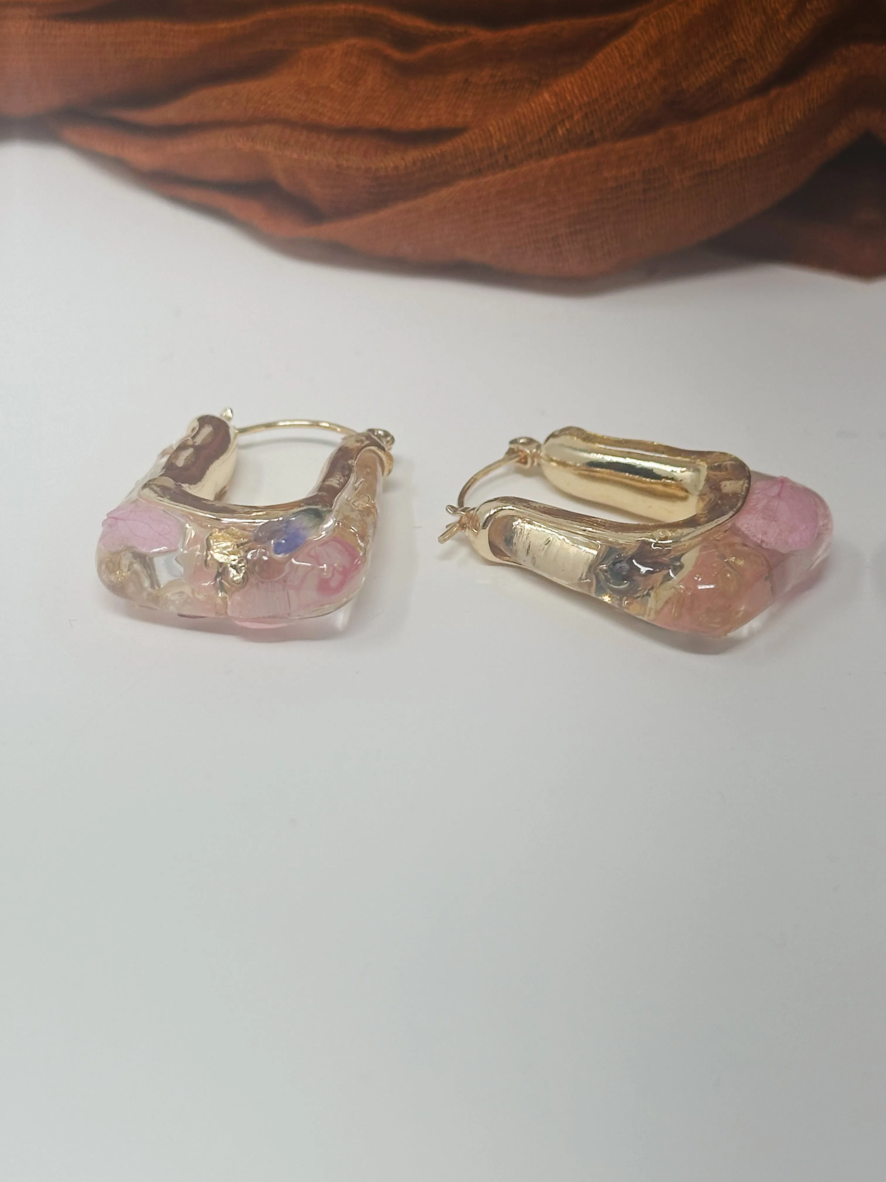 Resin hoops with real pressed pink and purple flowers inside