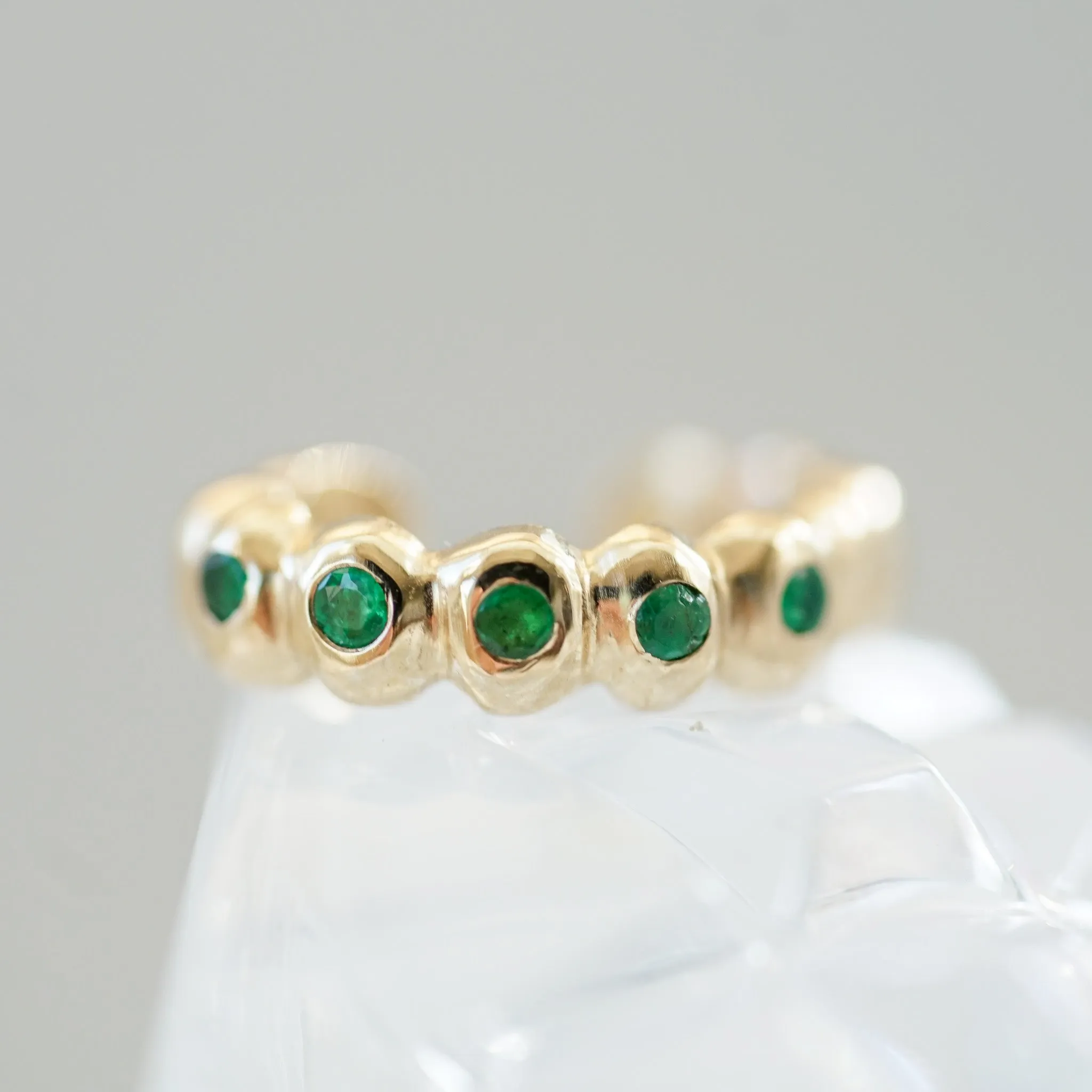 Scalloped gold ear cuff with Emeralds