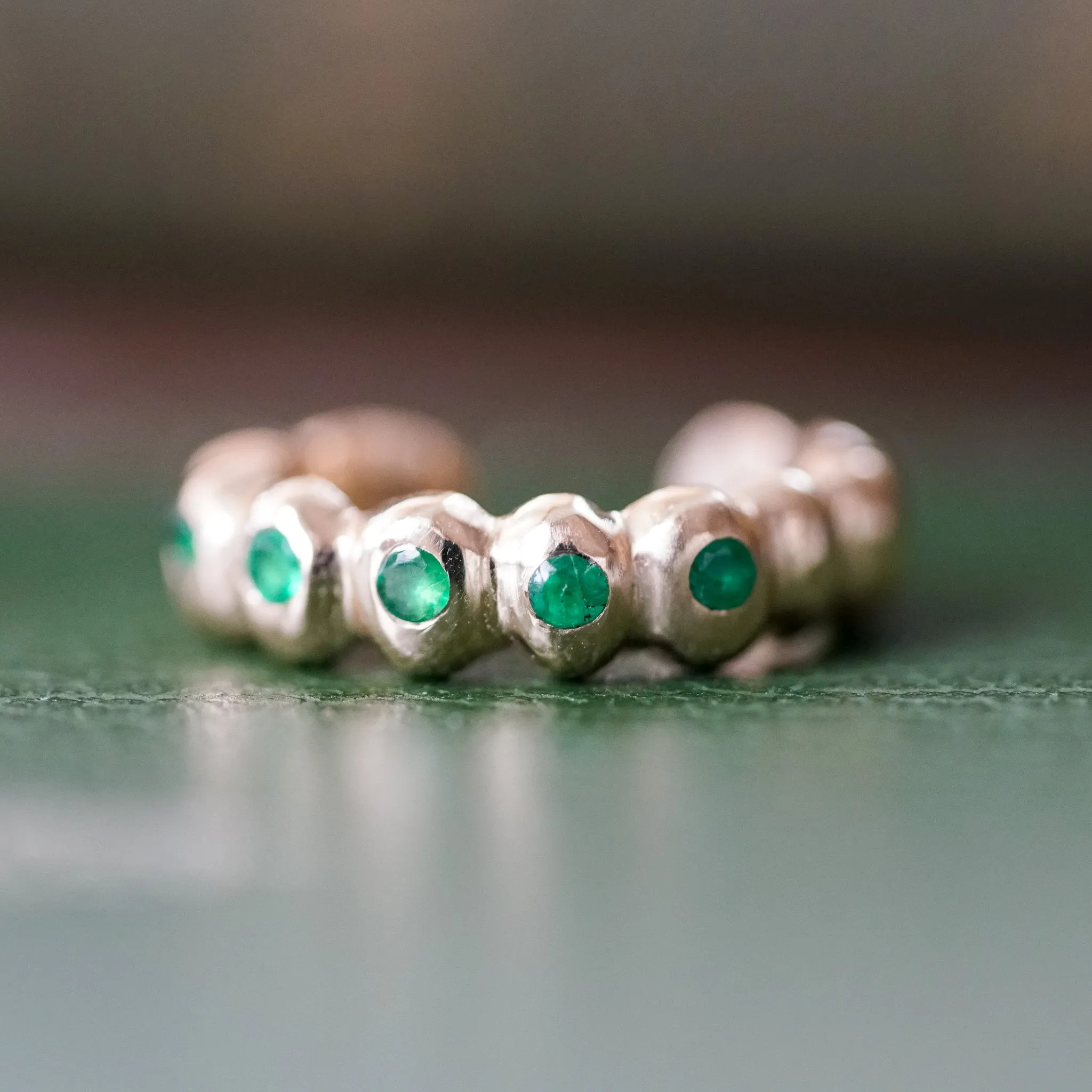 Scalloped gold ear cuff with Emeralds