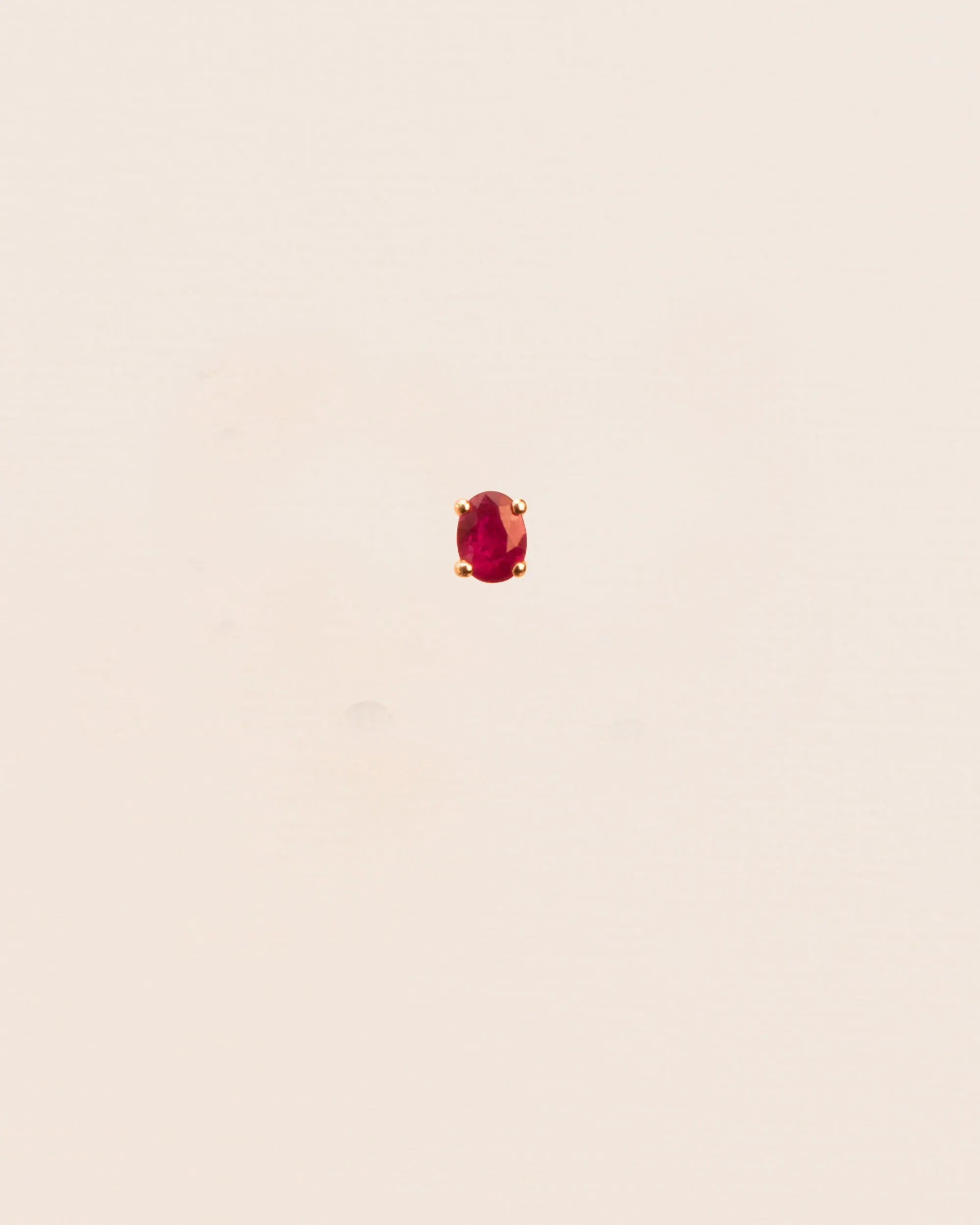 Single stud earring with ruby in 18 ct. gold