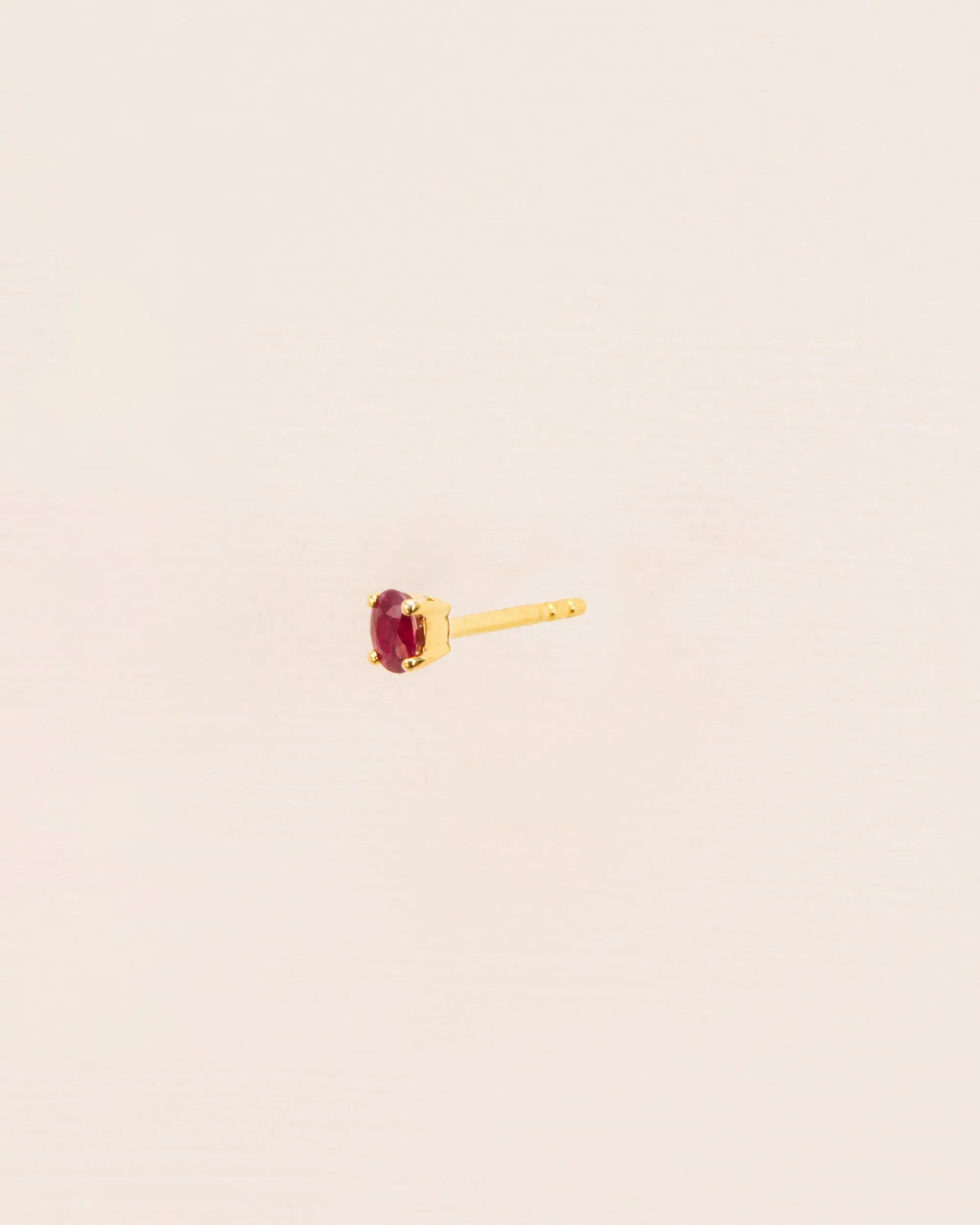 Single stud earring with ruby in 18 ct. gold